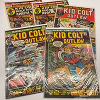 All five bagged comics fanned out showing covers