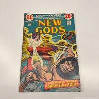 Front cover of New Gods #11 comic showing title, price, art