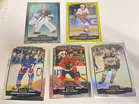 Five O-Pee-Chee Platinum hockey cards laid out showing fronts and foil finishes