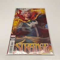 Front view of bagged Strange #1 comic showing full cover artwork and Marvel issue barcode