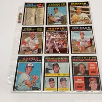 Fronts of all nine 1971 OPC baseball cards in binder sleeve