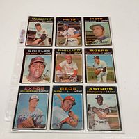 Front view of nine 1971 OPC cards in 3×3 plastic page
