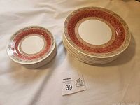 Stack of eight dinner plates and eight salad plates showing pattern and size comparison