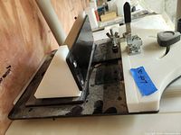 Adjustable work jig/table showing fence, angled guide and clamp