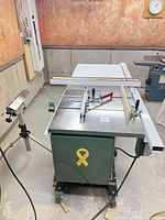 Full view of General 650 table saw with fence and outfeed table