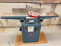 Front view of JET 8 inch jointer-planer showing cast-iron tables, fence, cutter guard, and control panel