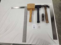 group shot of four hammers/mallets for size context