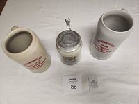 Top view showing interiors and lid detail of three steins