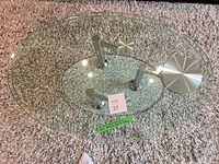 Top view showing two overlapping glass ovals, chrome supports and brushed caps