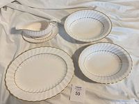 Overview of platter, two serving bowls, gravy boat and underplate