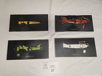 All four plaques laid out showing size and colour variety