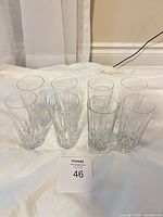 all eight crystal highball glasses upright on surface