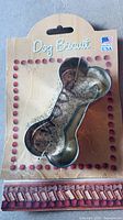 Dog bone cookie cutter sealed to Dog Biscuit card