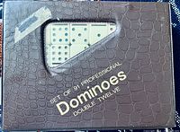 Faux-leather box labelled "Set of 91 Professional Dominoes Double Twelve"