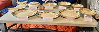 All Franciscan Desert Rose serving pieces arranged on table