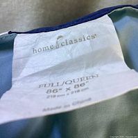 Care label showing Home Classics brand and size 86"x86"