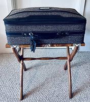 Front view with suitcase on stand