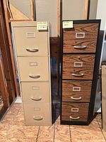 Two vertical 4-drawer filing cabinets side by side