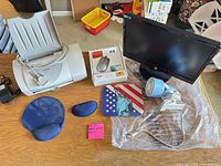 Group shot of monitor, printer, mouse box, fan, mouse pad, wrist rests, cables