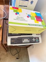 Printer front view with aftermarket cartridge box on top
