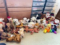 Group shot of all plush lined against drawers