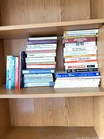 Books on shelf showing quantity and titles
