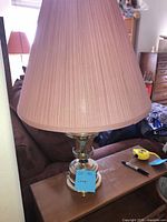 Full lamp with pink shade visible
