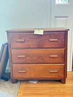 Front view of three-drawer dresser