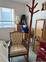 Rocking chair front view with coat tree beside