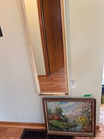 Mirror and framed print together showing scale and placement
