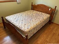 bed frame assembled with mattress in room