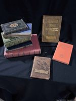 All eight books grouped together front view