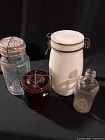 Group shot of four vintage containers