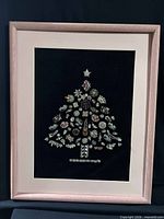 Front view of framed jewelry tree art showing entire piece