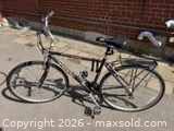 Right side full view of Trek 720 Multitrack bike showing frame, wheels, rack