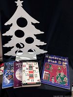 Metal tree and four books overview