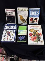 Front covers of all six guide books displayed