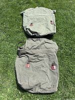 Two Woods canvas canoe packs front view on grass