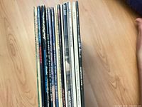 Side view of stacked LPs showing spines and quantity