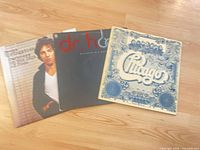 Three LP jackets: Springsteen, Dr. Hook, Chicago