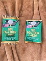 Front view of both sealed 1991 Pro Set PGA Tour card packs