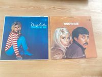 Front jackets of both LPs side by side