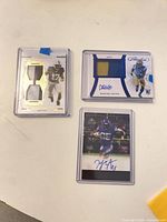 All three NFL autograph/patch cards in holders