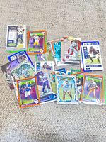 Pile of assorted football trading cards showing mix of brands and designs