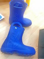 Blue Crocs boots side view
