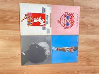 Four Barbra Streisand LP album covers laid out on floor