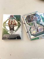 Giannis Epic Performers insert and Khris Middleton green/silver Prizm card