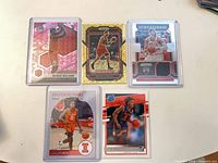Five Bulls cards in toploaders including Mosaic pink Patrick Williams and Ayo Dosunmu rookie