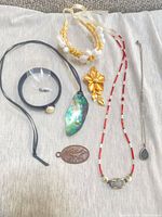 All seven jewelry pieces laid out together