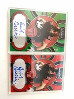 Two Daniel Bellinger autographed Mania trading cards in magnetic cases